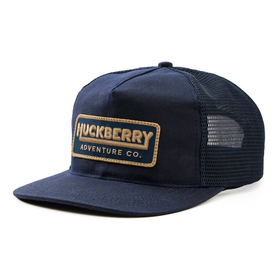 91142_Huckberry_Huckberry_Adventure_Co._Waxed_Canvas_Trucker_Navy_01_Product_on_White